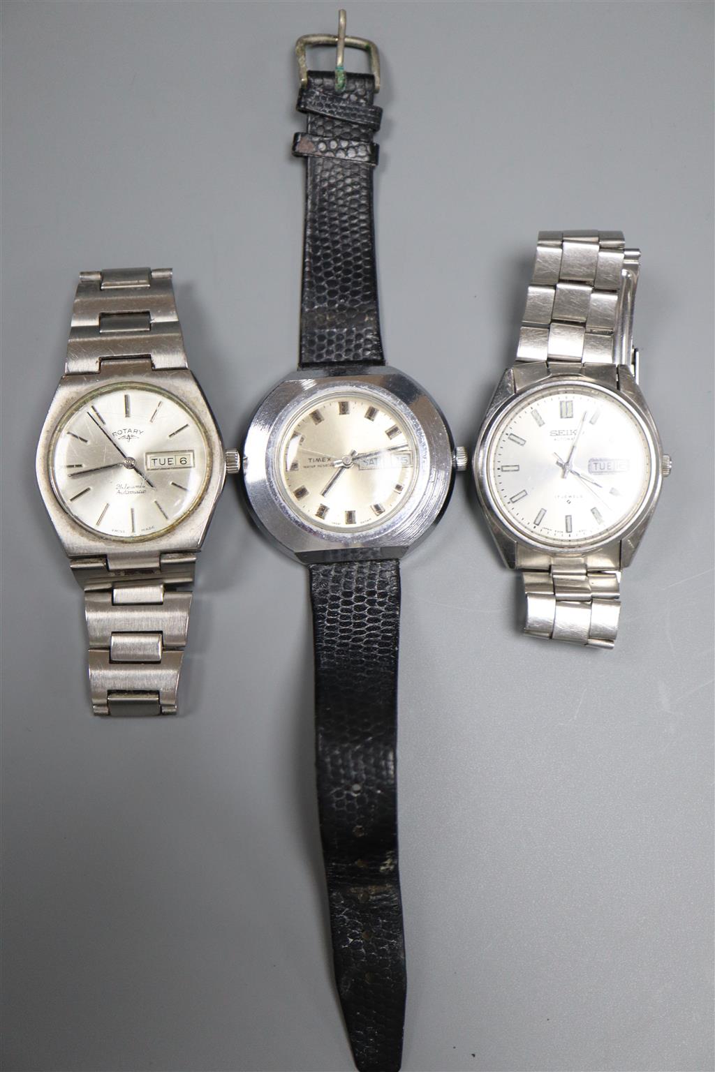 Three assorted gentlemans wrist watches including Seiko, Rotary and Timex.